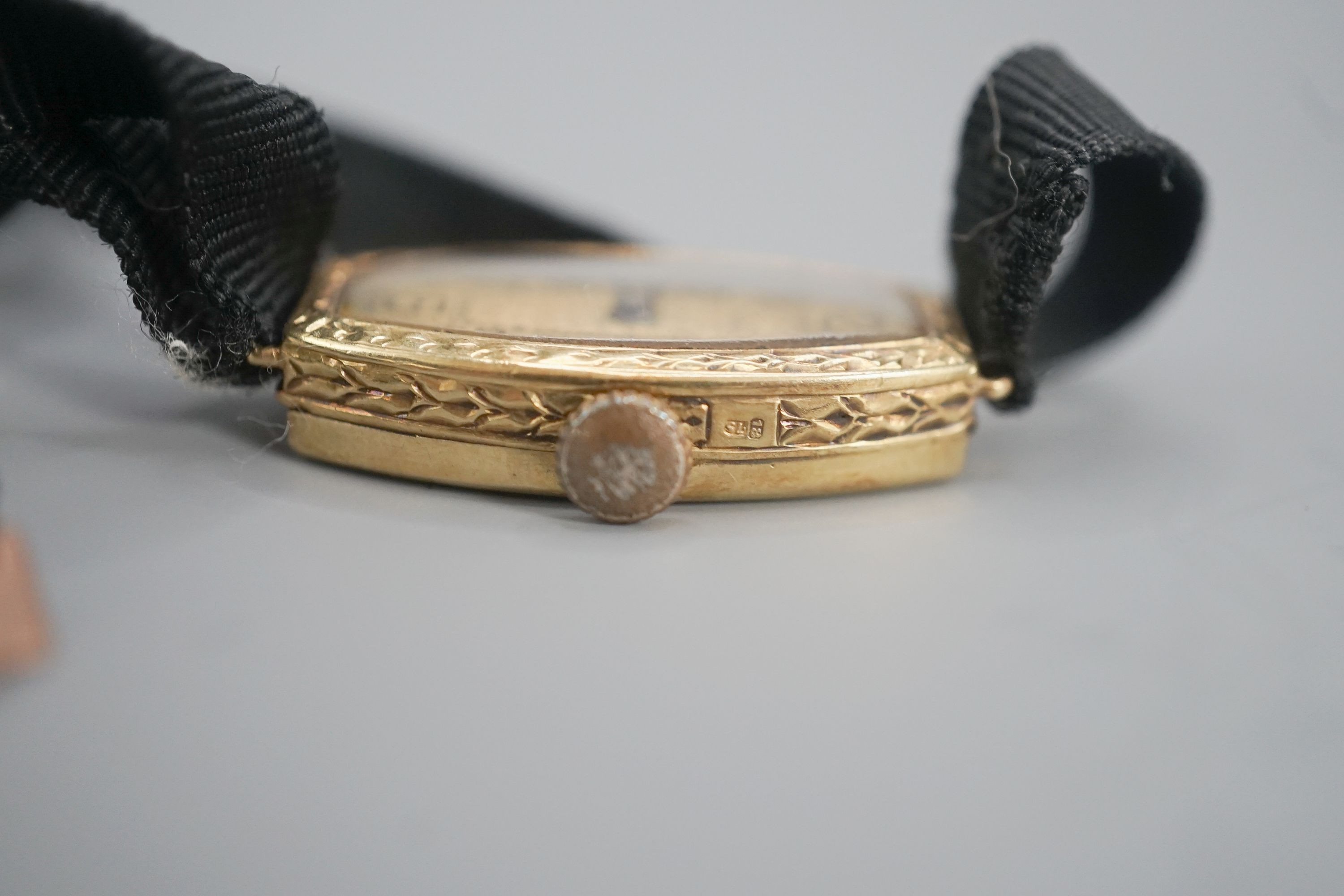 A lady's early 20th century 18ct gold manual wind wrist watch, case diameter 17mm, on a sash strap with 9ct buckle